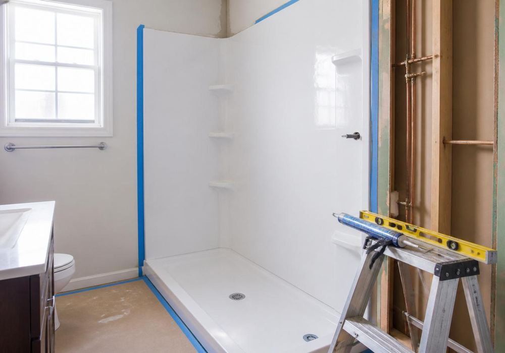 Entryway mid-installation with a new door staged